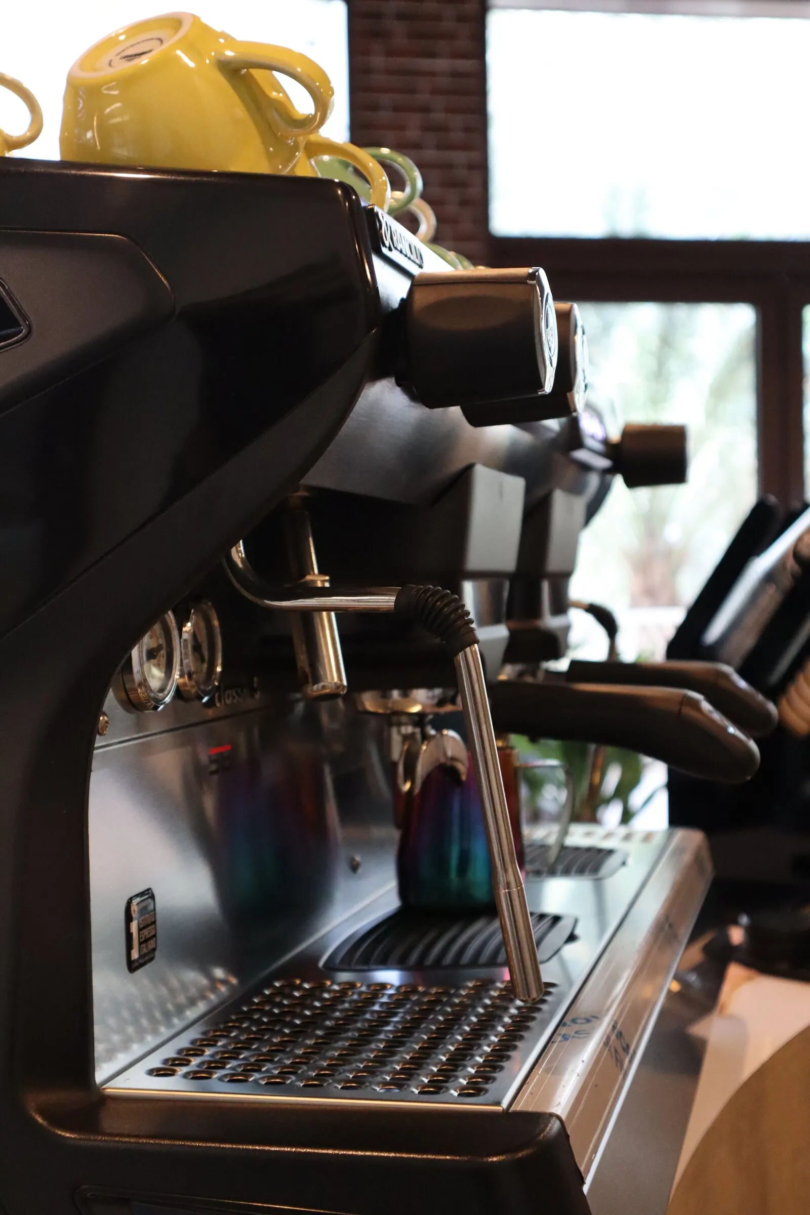 Close-up of the espresso machine group head at Chalk Training Ground cafe